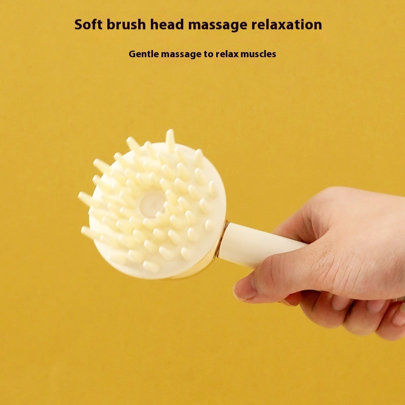Hand holding soft brush head for gentle muscle massage on 3 in 1 bath all-in-one pet grooming brush