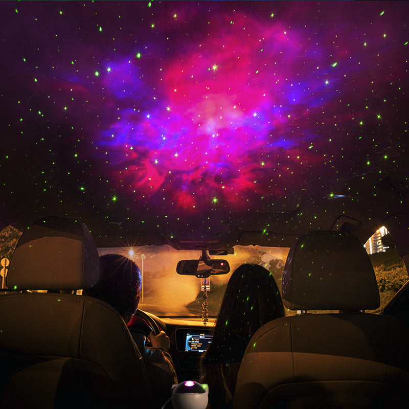 Astronaut galaxy projector lamp creating colorful starry sky projection inside a car roof