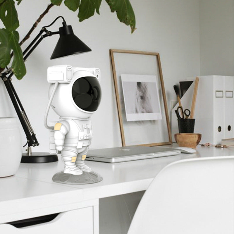 Sheila Merchandise astronaut galaxy projector lamp shaped like a white astronaut on a modern white office desk