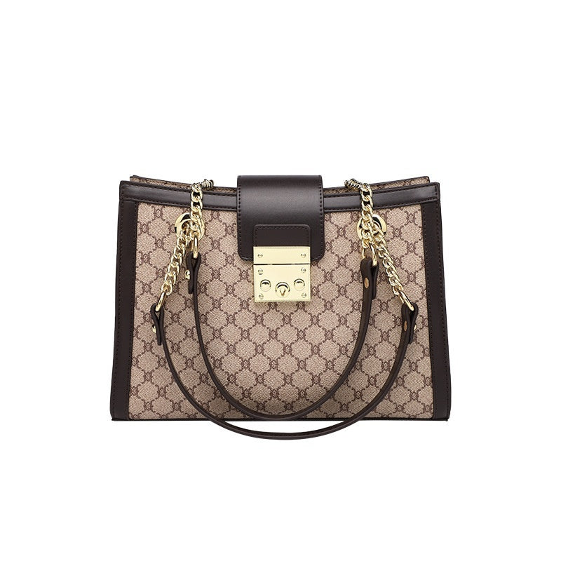 Elegant brown patterned handbag with gold chain straps, a perfect addition to stylish leather handbags collection