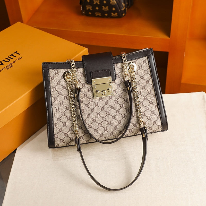 Stylish leather handbags beige and black designer tote with chain straps on display