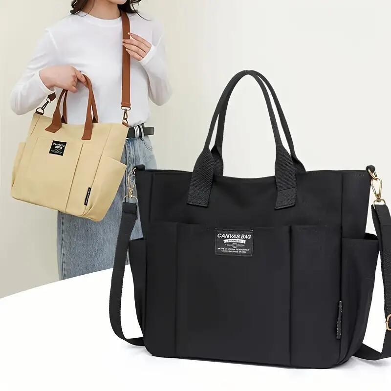 Sheila Merchandise multi pocket shoulder bag in black and beige with sturdy handles and detachable strap