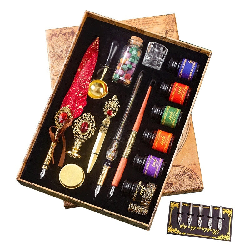 Classical Feather Pen Set by Sheila Merchandise with red feather quill pens, ink bottles, and vintage writing accessories