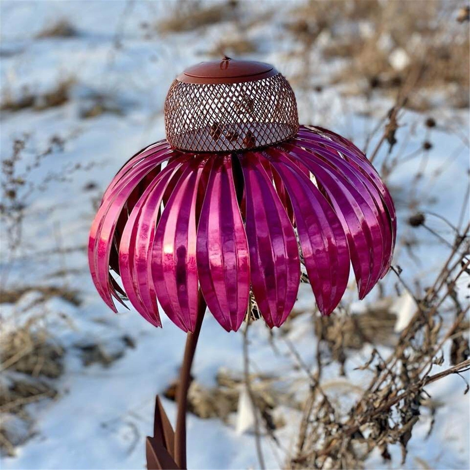 Sheila Merchandise petal shaped bird feeder in bright purple metal with mesh seed holder outdoors
