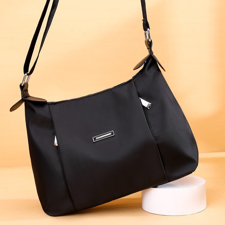 Black everyday fashion handbag for women by Sheila Merchandise with adjustable strap and silver accents