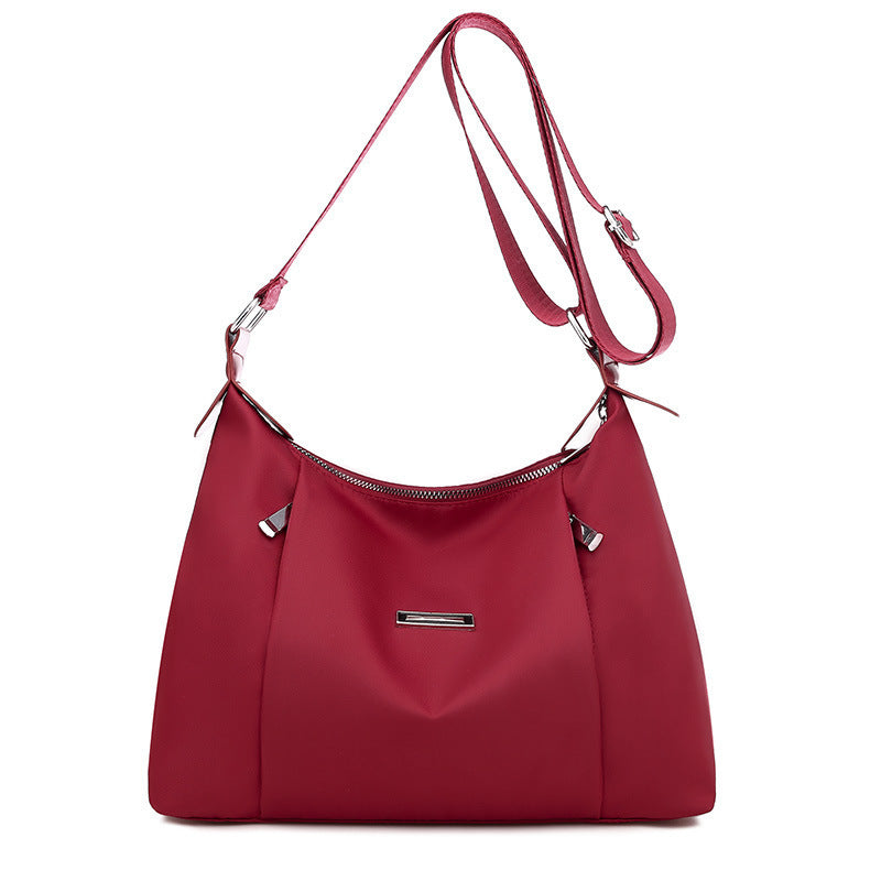 Red everyday fashion handbag for women with adjustable strap and silver hardware from Sheila Merchandise