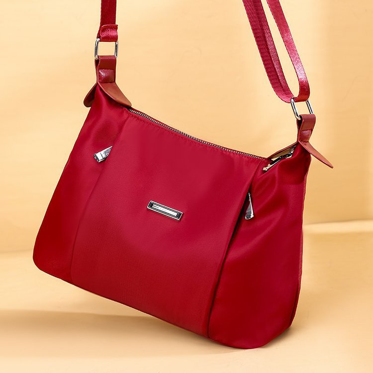Red everyday fashion handbag for women by Sheila Merchandise with adjustable strap and sleek design