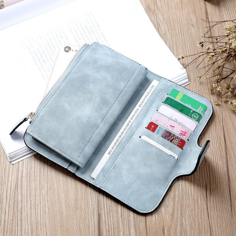 Matte PU leather multi function wallet for women with multiple card slots and a zippered pocket in light blue