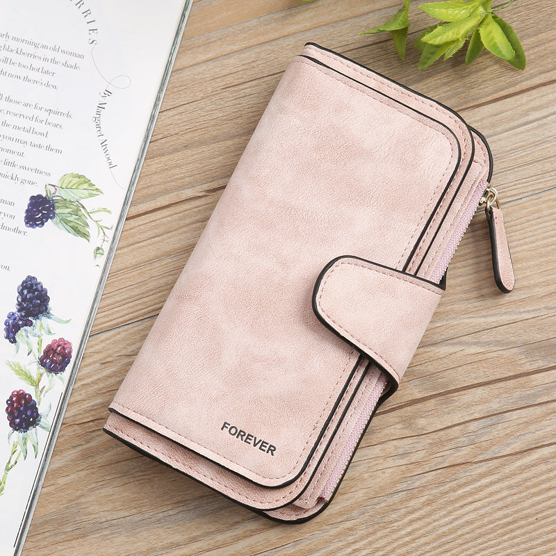 Matte PU leather multi function wallet for women in light pink with snap and zipper closure by Sheila Merchandise