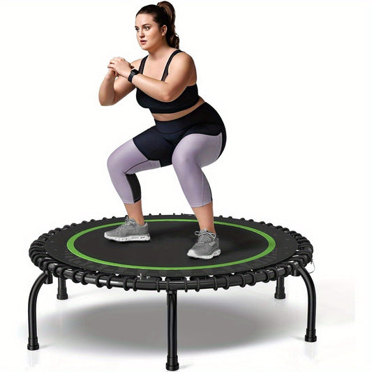 Woman exercising on a Sheila Merchandise home fitness trampoline in black and green for indoor workouts