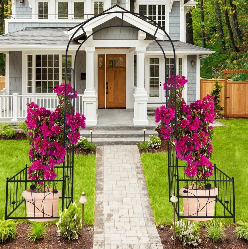 Elegant metal garden arch supporting vibrant pink flowers, enhancing outdoor pathways and entryways
