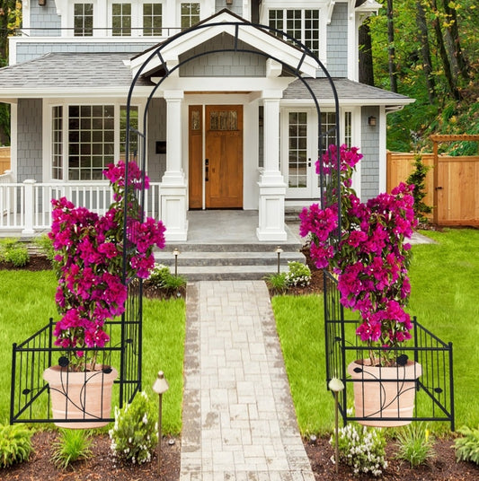 Elegant metal garden arch supporting vibrant pink flowers, enhancing outdoor pathways and entryways