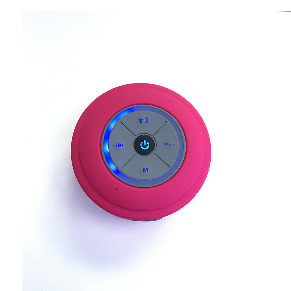 Sheila Merchandise mini waterproof Bluetooth speaker in pink with top control buttons and blue LED light