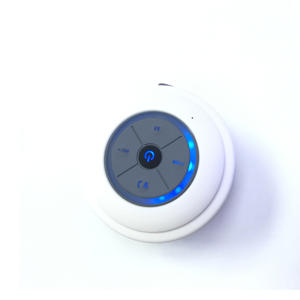 Sheila Merchandise mini waterproof Bluetooth speaker in white with blue LED lights and control buttons