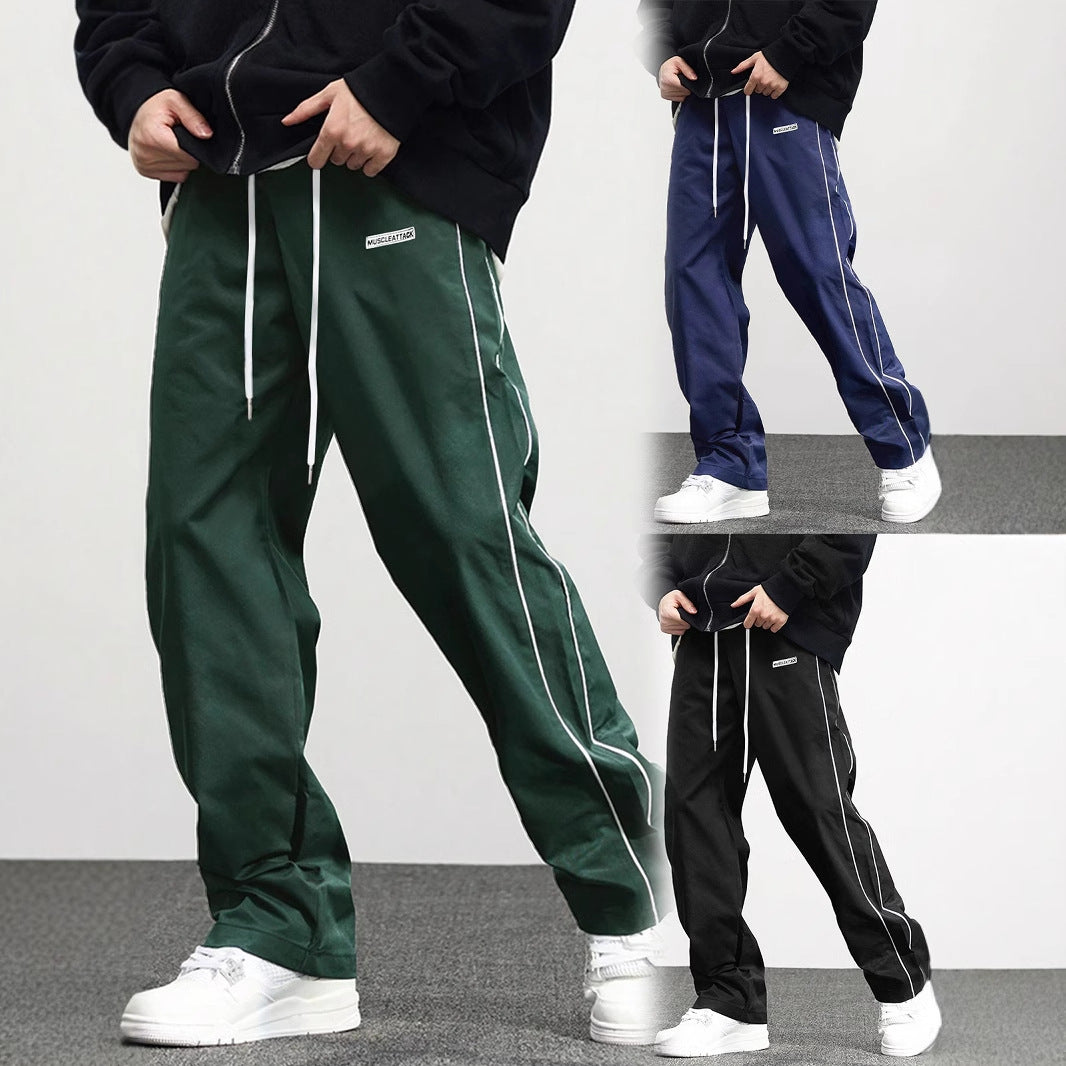 Men's comfortable jogger pants in green, navy, and black with side pockets and a loose fit
