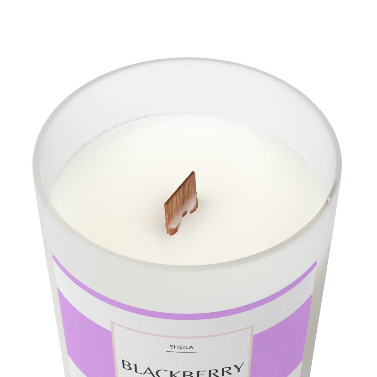 Blackberry vanilla candle in a clear glass jar with a wooden wick for a soothing ambiance