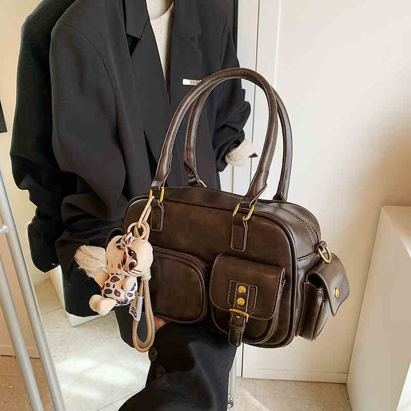 Sheila Merchandise women's brown leather shoulder Boston bag with multiple pockets and a stylish underarm purse design