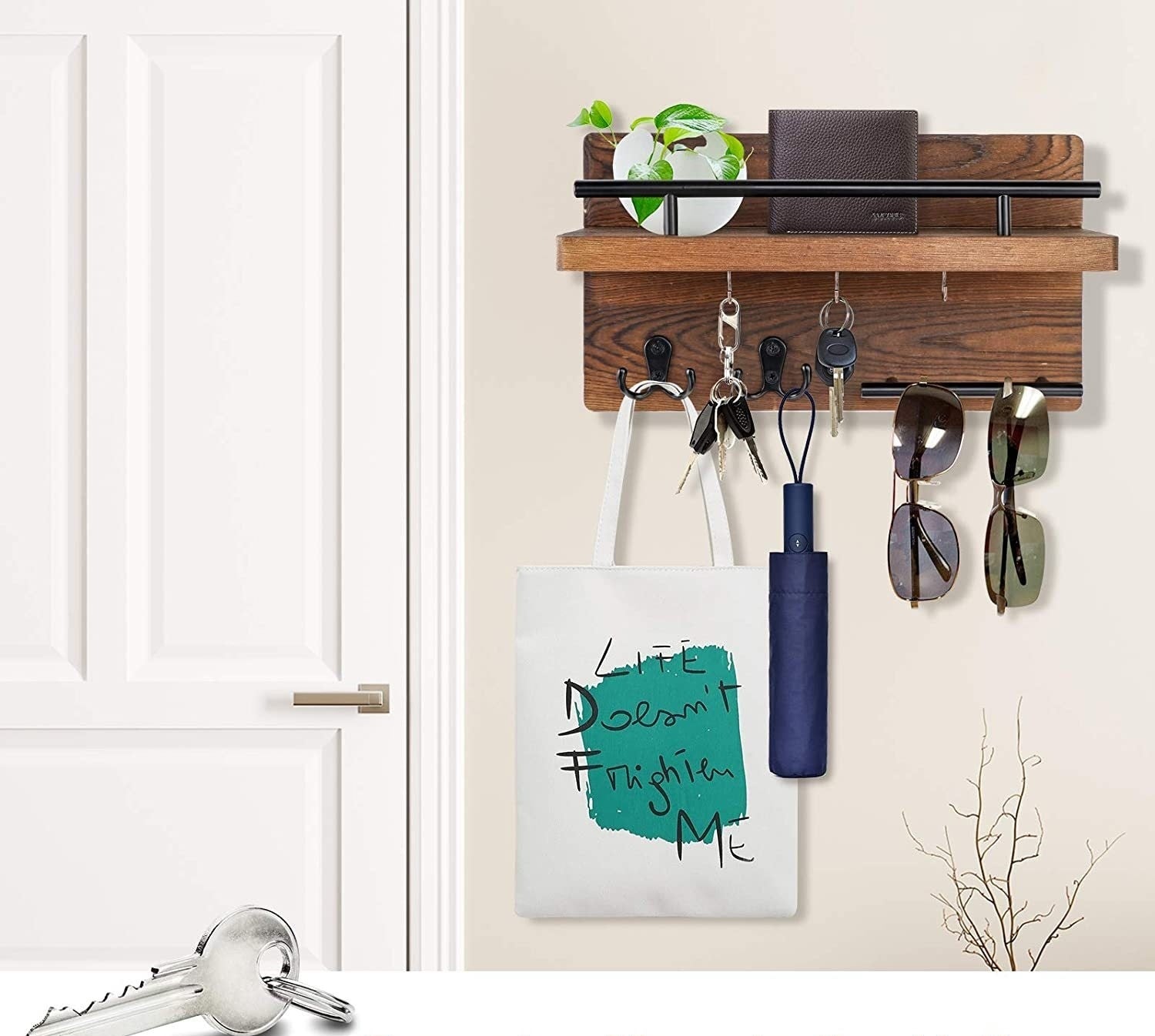 Sheila Merchandise wall-mounted wooden shelf with hooks holding keys, sunglasses, umbrella, and tote bag