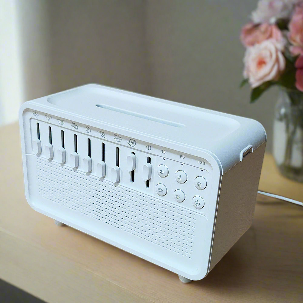 Sheila Merchandise white noise sleep lamp with multiple sliders and buttons on a wooden table