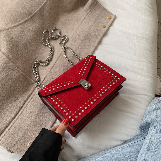 Women's red leather purse with chain and studded detailing from Sheila Merchandise