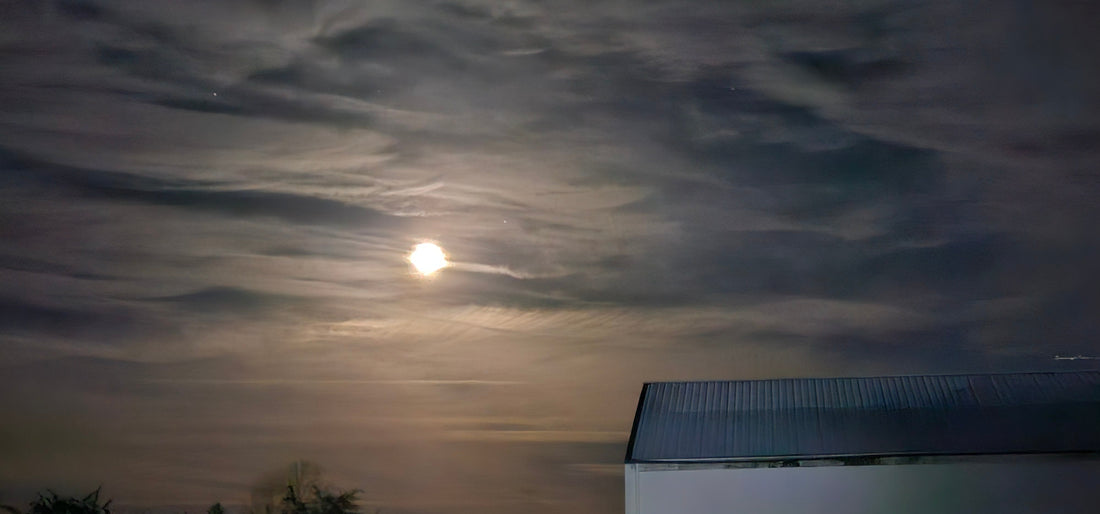 Night sky with moon and clouds above a building under soft evening light accessories for every occasion