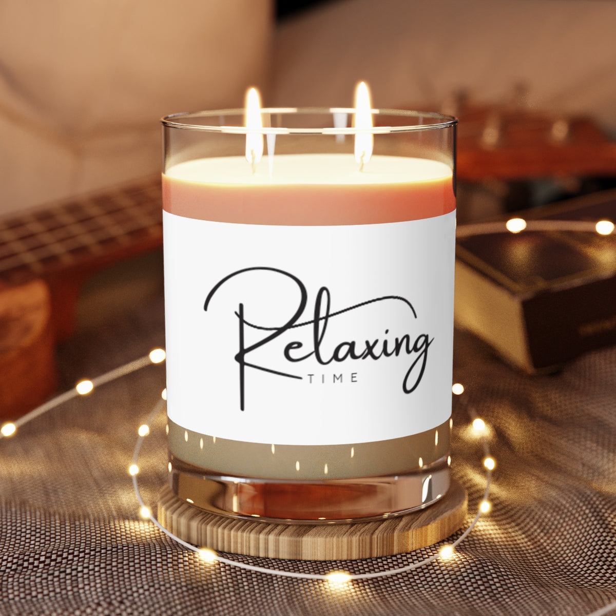 Aromatic candles home decor with a relaxing time label in a stylish glass holder on a textured surface