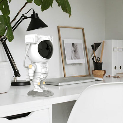 Sheila Merchandise astronaut galaxy projector lamp shaped like a white astronaut on a modern white office desk