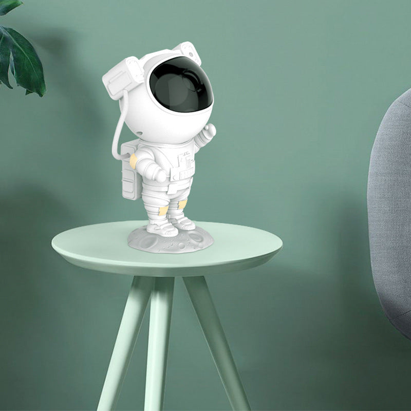 Sheila Merchandise astronaut galaxy projector lamp shaped like a white astronaut on a small table