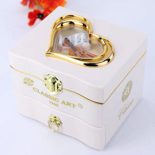Sheila Merchandise musical ballet dancer box with heart-shaped glass and gold accents on white jewelry box