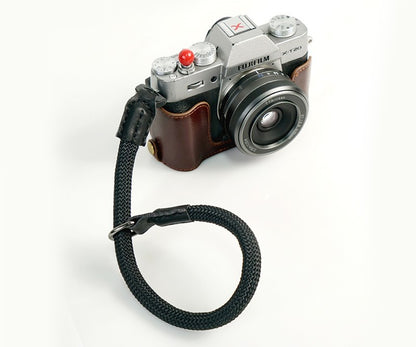 Durable camera wrist strap attached to Fujifilm camera with brown leather case by Sheila Merchandise