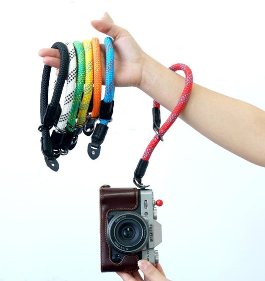 Sheila Merchandise durable camera wrist strap in multiple colors attached to a camera for secure handling