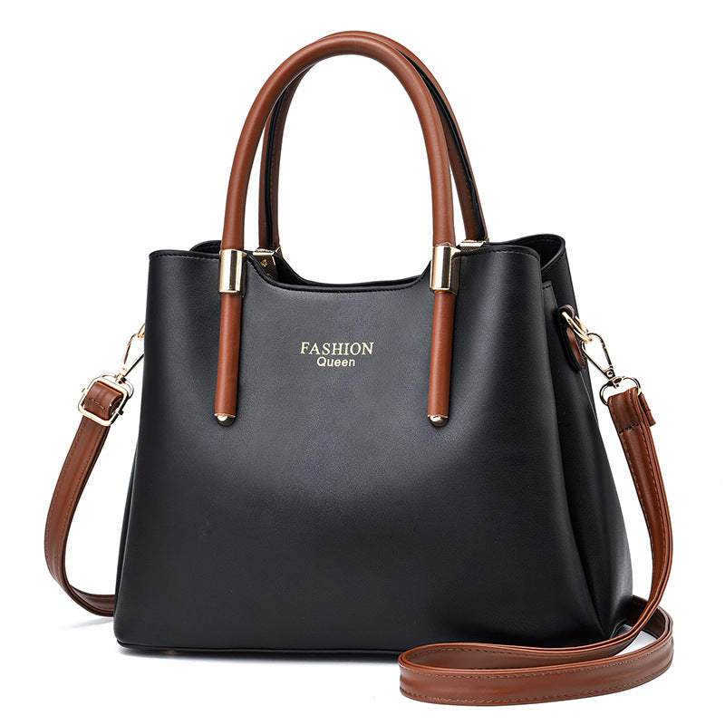 Stylish red handbag with long strap by Sheila Merchandise in black and brown with gold accents