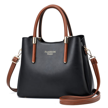 Stylish red handbag with long strap by Sheila Merchandise in black and brown with gold accents