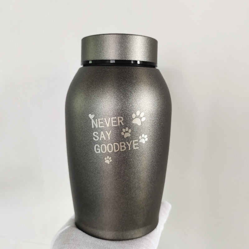 Sheila Merchandise stainless steel pet urn with Never Say Goodbye engraving and paw prints