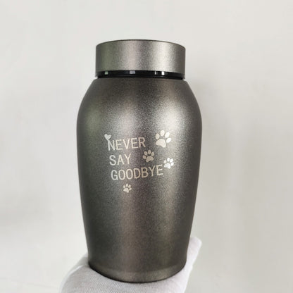 Sheila Merchandise stainless steel pet urn with Never Say Goodbye engraving and paw prints