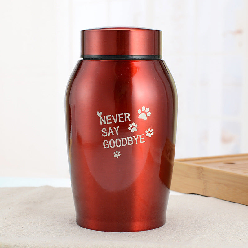 Red stainless steel pet urn with Never Say Goodbye inscription and paw prints by Sheila Merchandise