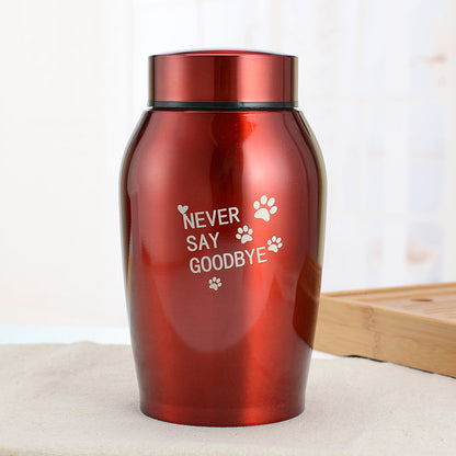 Red stainless steel pet urn with Never Say Goodbye inscription and paw prints by Sheila Merchandise