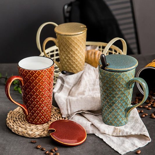 Handcrafted ceramic tea mug in red with diamond pattern and matching lid by Sheila Merchandise