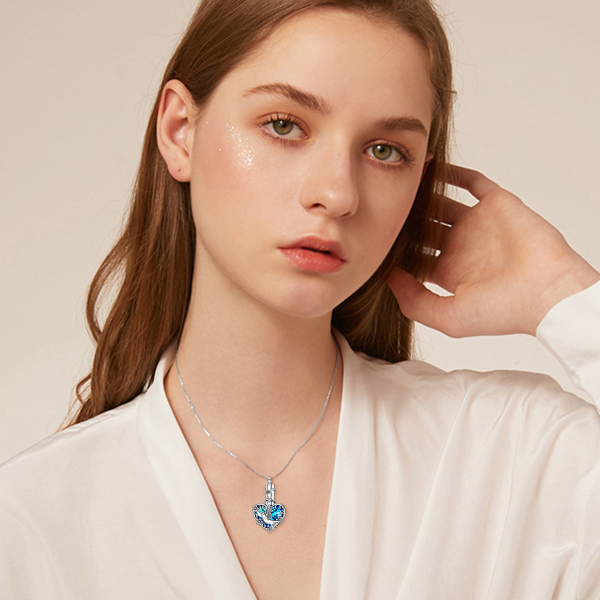 Crystal hummingbird urn necklace in sterling silver worn by woman with hummingbird cremation jewelry