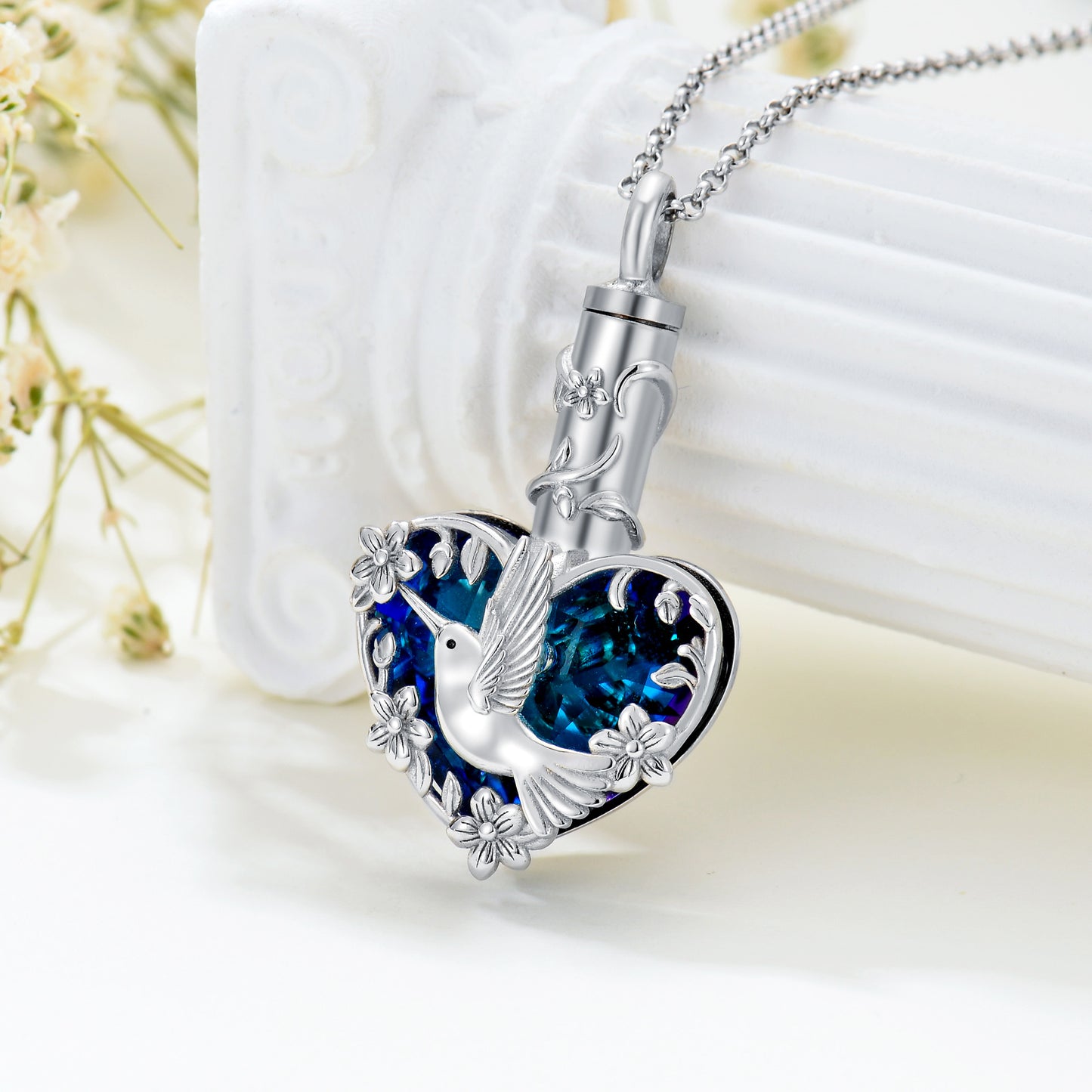 Crystal hummingbird urn necklace in sterling silver with blue heart gem and flowers hummingbird cremation jewelry