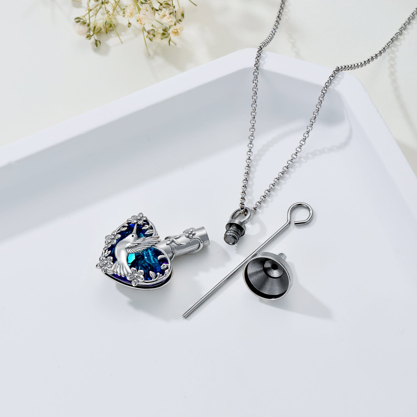 Crystal hummingbird urn necklace with blue accents and silver chain hummingbird cremation jewelry from Sheila Merchandise