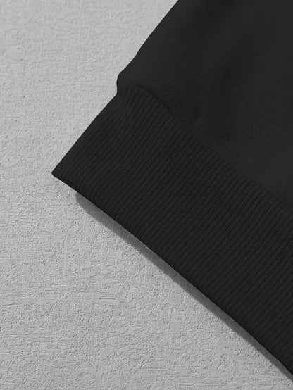 Close-up of the cuff detail on the I Love Jesus women's hoodie in black fabric