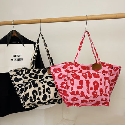 Popular leopard print tote bag in black and cream and pink and red with large capacity nylon material