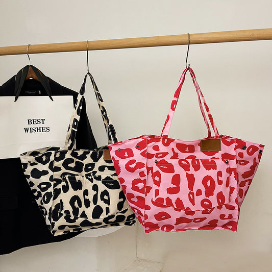 Popular leopard print tote bag in black and cream and pink and red with large capacity nylon material