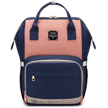 Sheila Merchandise parent-approved diaper backpack in navy and pink with multiple compartments
