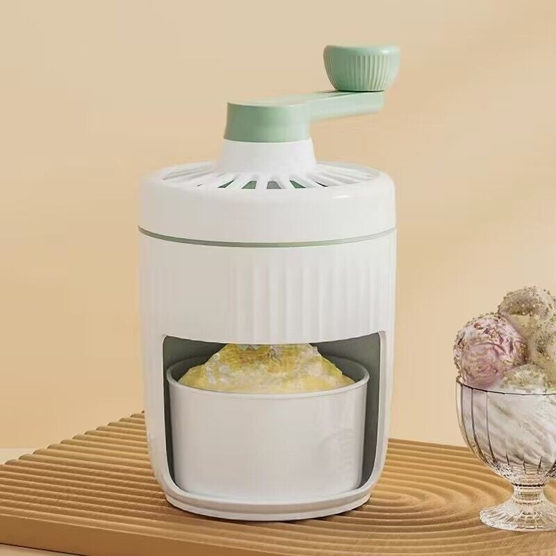 Sheila Merchandise mini slush machine for home in white and green with a bowl of shaved ice under the hand crank