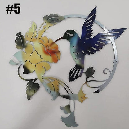 Colorful metal hummingbird wall art featuring a blue hummingbird and yellow flower by Sheila Merchandise