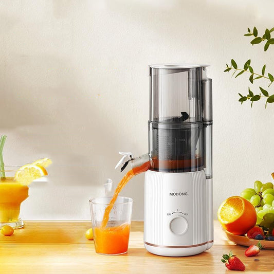Sheila Merchandise home juicing machine pouring fresh orange juice into glass on wooden table