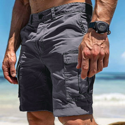 Sheila Merchandise multi pocket cargo shorts for men in gray worn at the beach with multiple side pockets