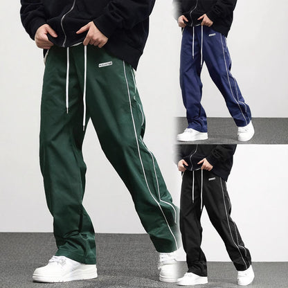Men's comfortable jogger pants in green, navy, and black with side pockets and a loose fit